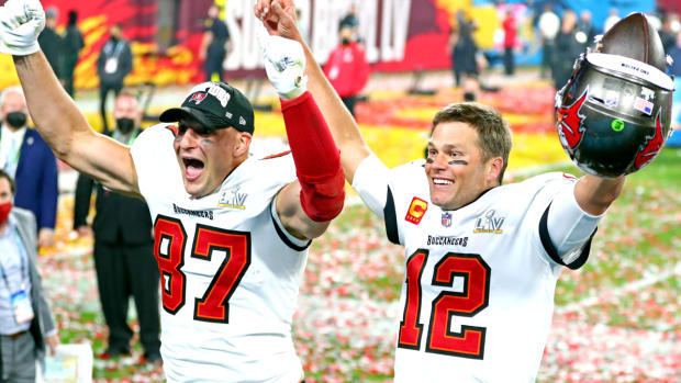 Feb 7, 2021; Tampa, FL, USA; Tampa Bay Buccaneers quarterback Tom Brady (12) and tight end Rob Gronkowski (87) celebrate after beating the Kansas City Chiefs in Super Bowl LV at Raymond James Stadium. Mandatory Credit: Mark J. Rebilas-USA TODAY Sports